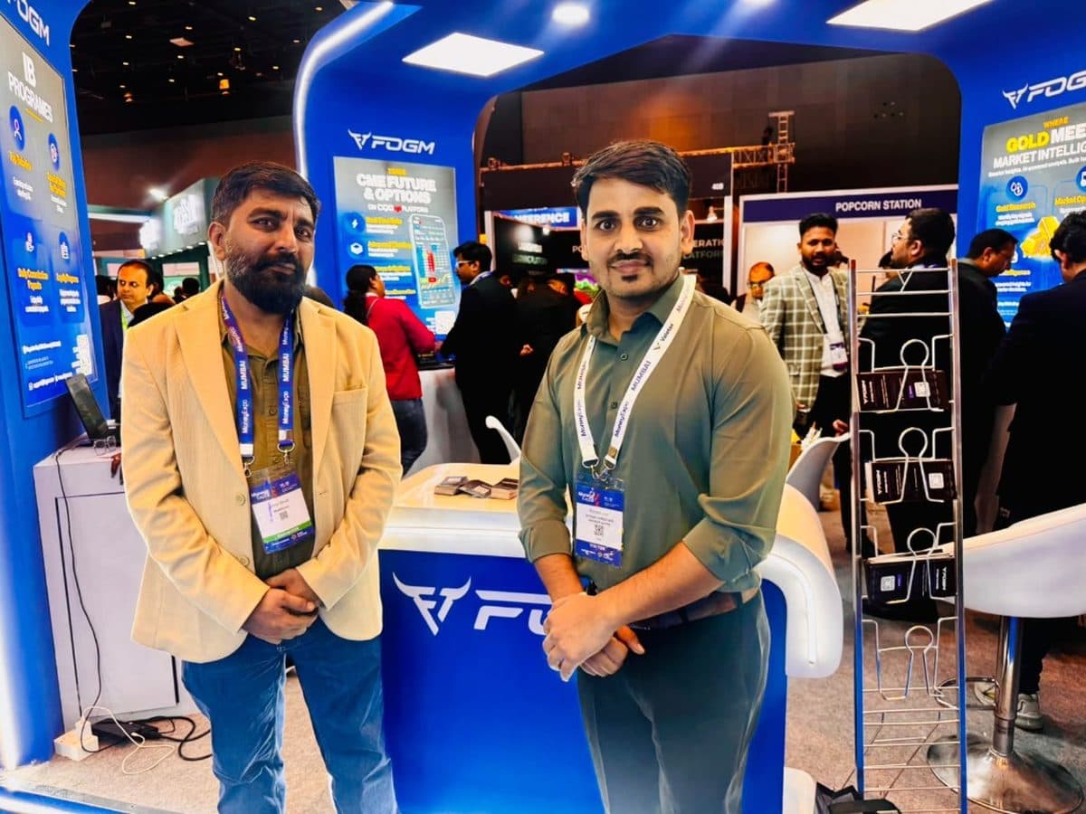 Ranjeet Saini with an exhibitor at a fintech expo booth