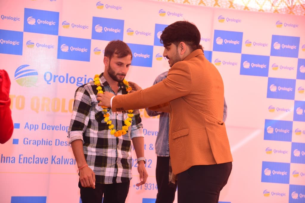 Ranjeet Saini being garlanded at the Qrologic office opening