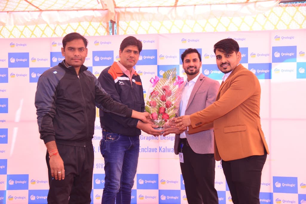Ranjeet Saini receiving a bouquet at the Qrologic office opening