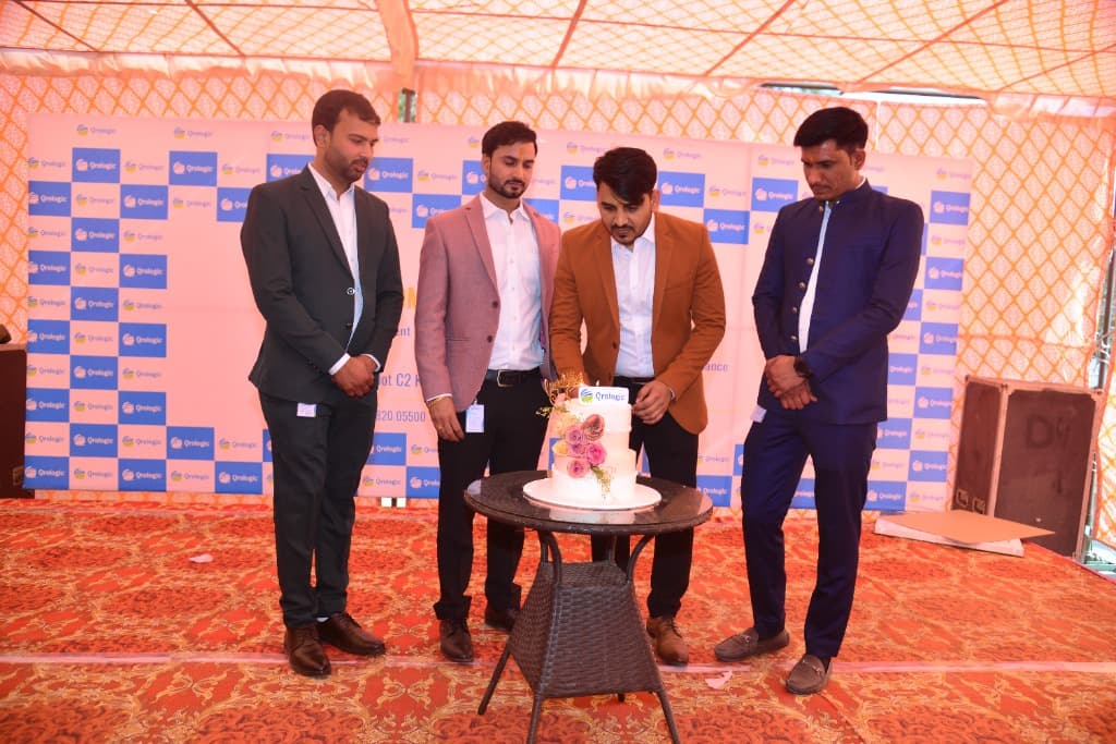 Ranjeet Saini at the Qrologic office opening — cutting the cake