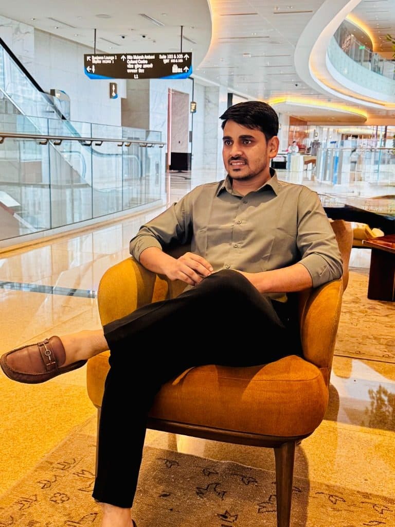 Ranjeet Saini seated in a lounge chair