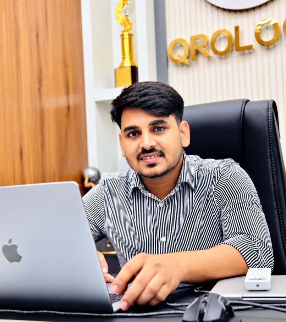 Ranjeet Saini working at his desk in the Qrologic office