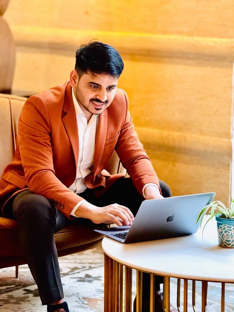 Ranjeet Saini working on a laptop